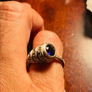 A sterling silver horn ring with blue stone